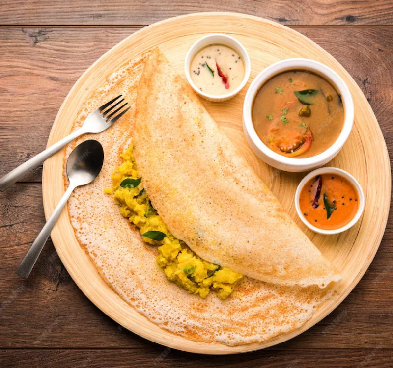 masala-dosa-is-south-indian-meal-served-with-sambhar-coconut-chutney-selective-focus_466689-22963